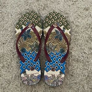 Tory Burch Flip Flops. Worn once, size 6 but runs very small around a 5